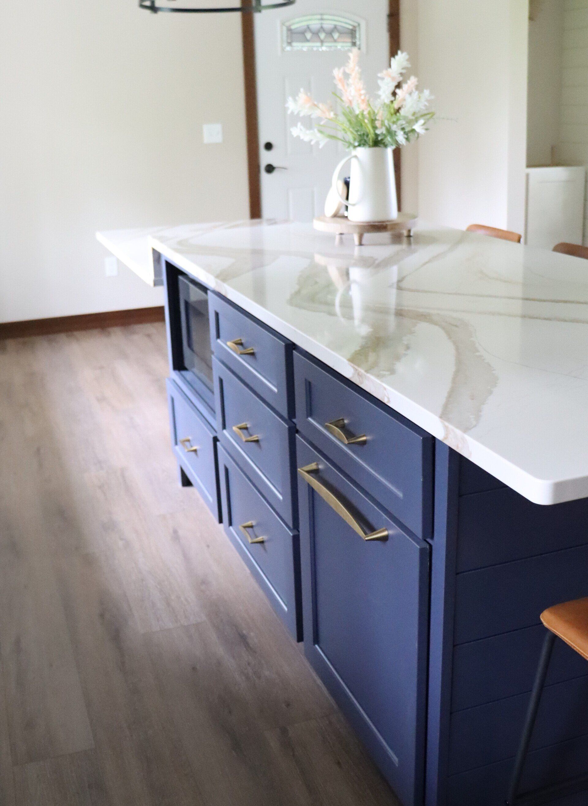 White Countertop with Blue Cabinets