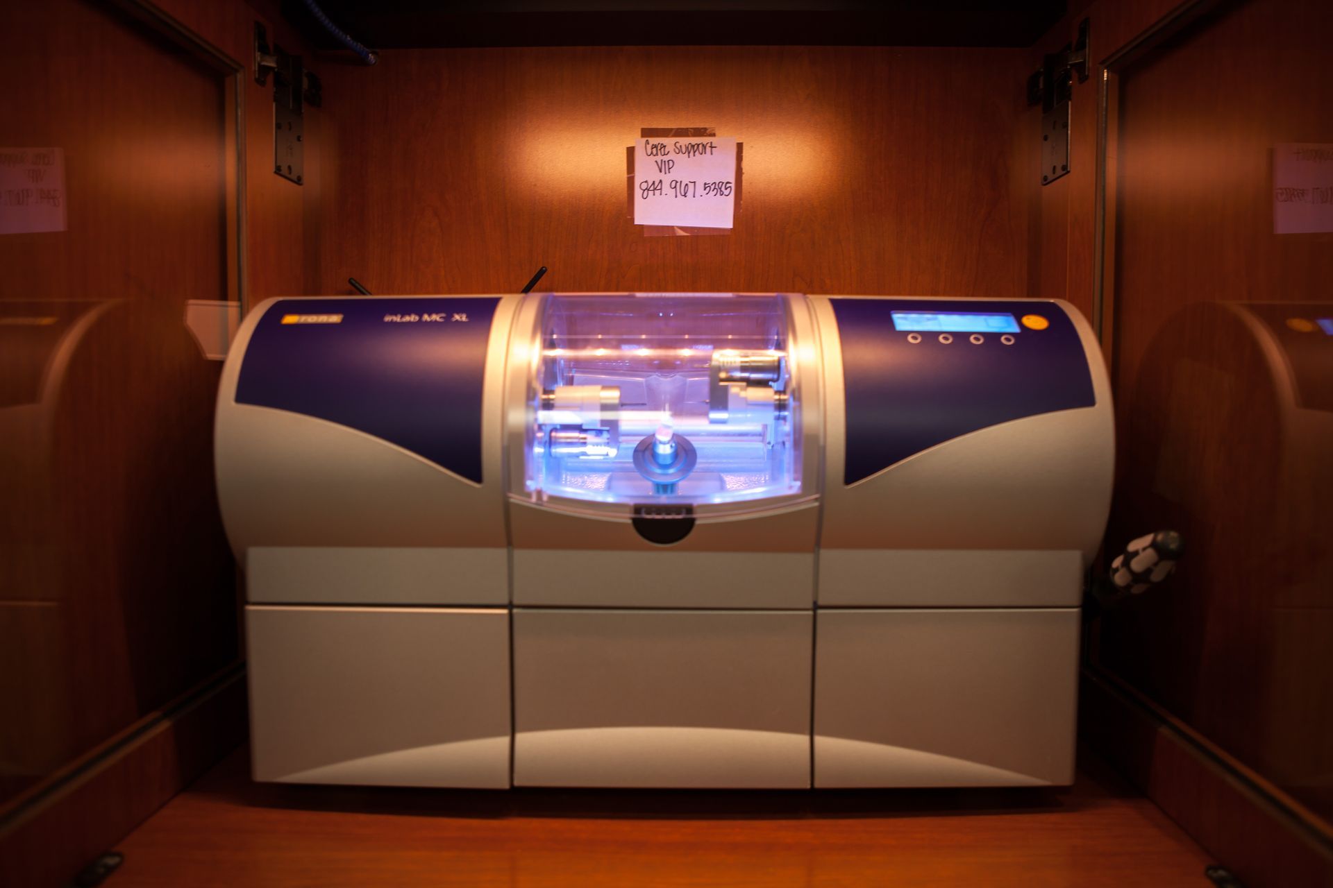 A machine in a room with a sign on the wall that says 4:20.