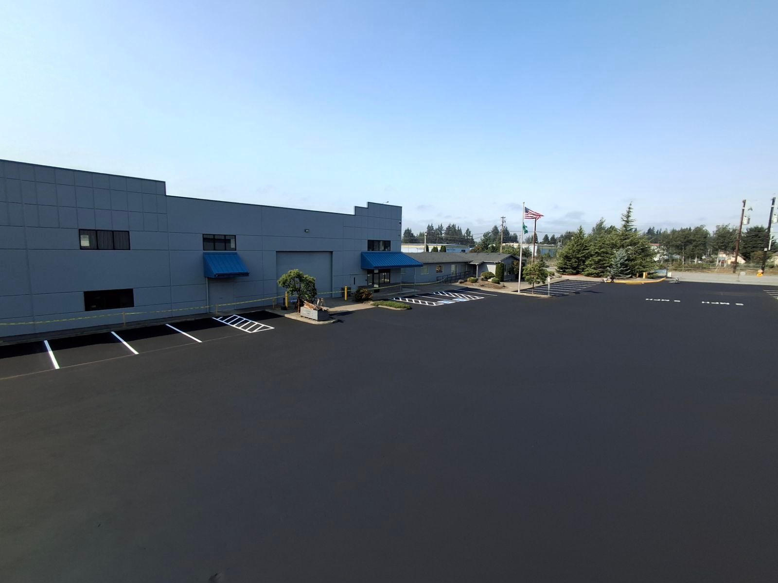 A large building with a parking lot in front of it