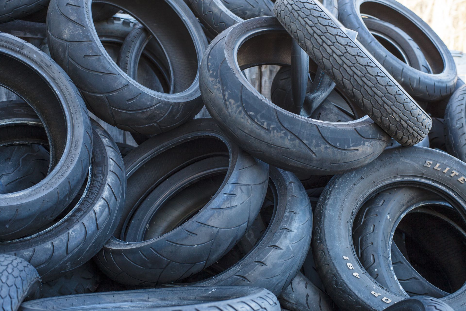 Pile of used motorcycle tires.