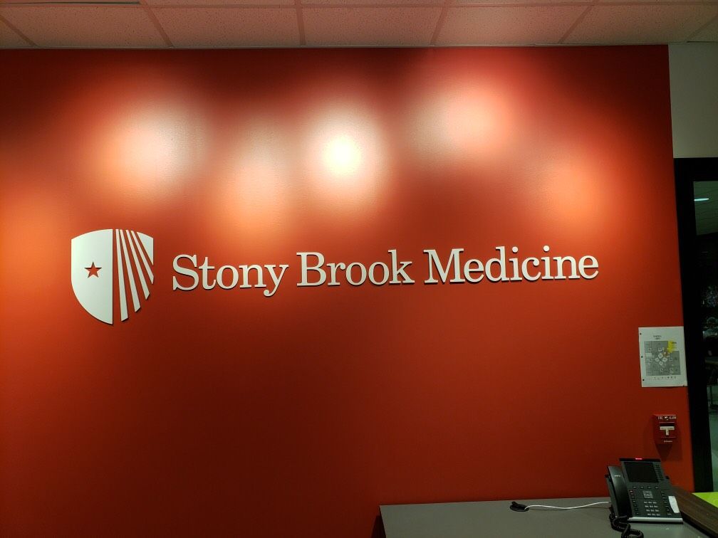Stony brook medicine is written on a red wall