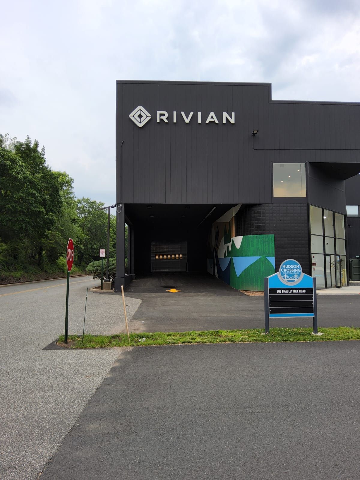 A black building with the word rivian on it