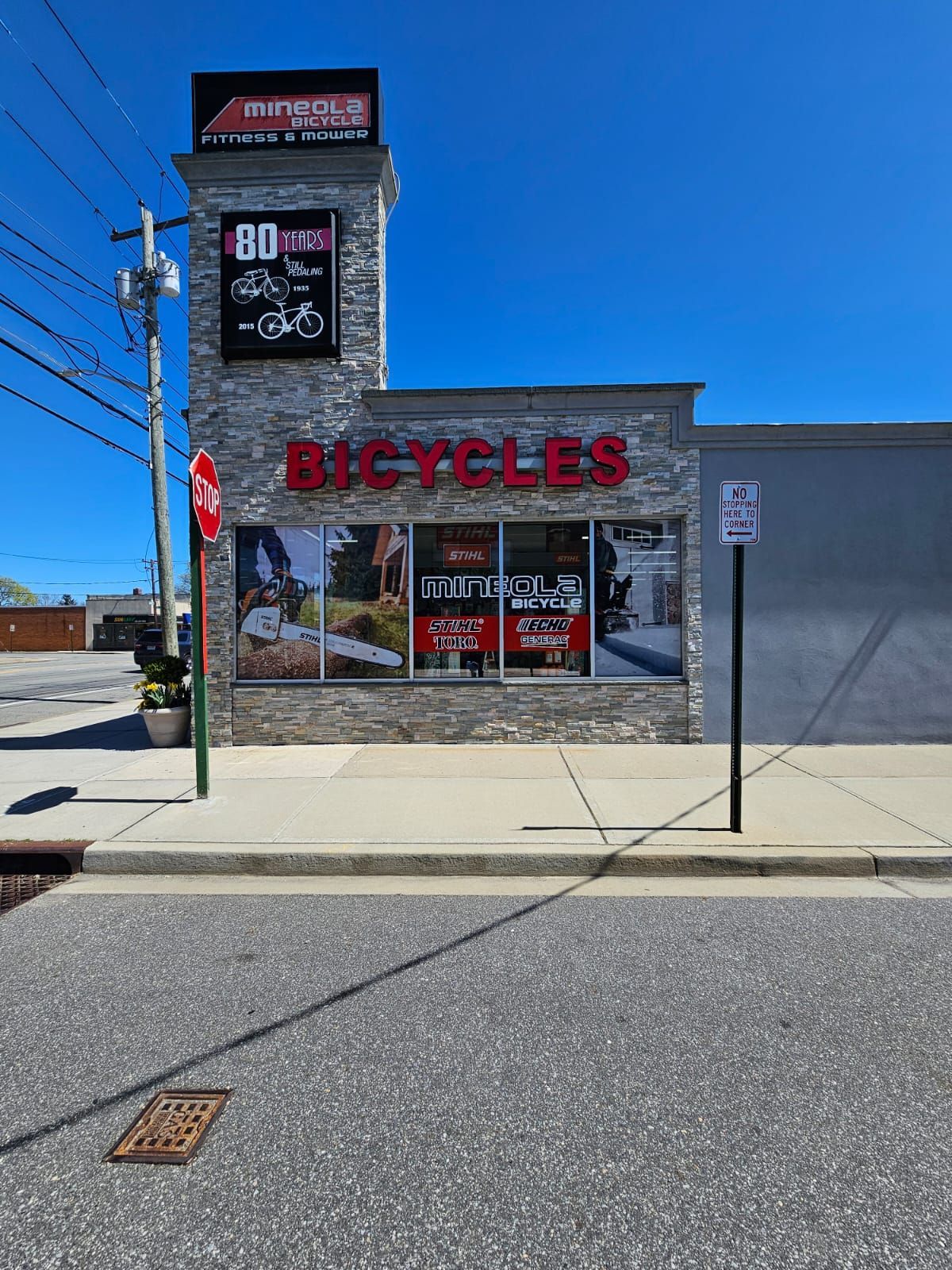 A bicycle shop is located on the side of the road.