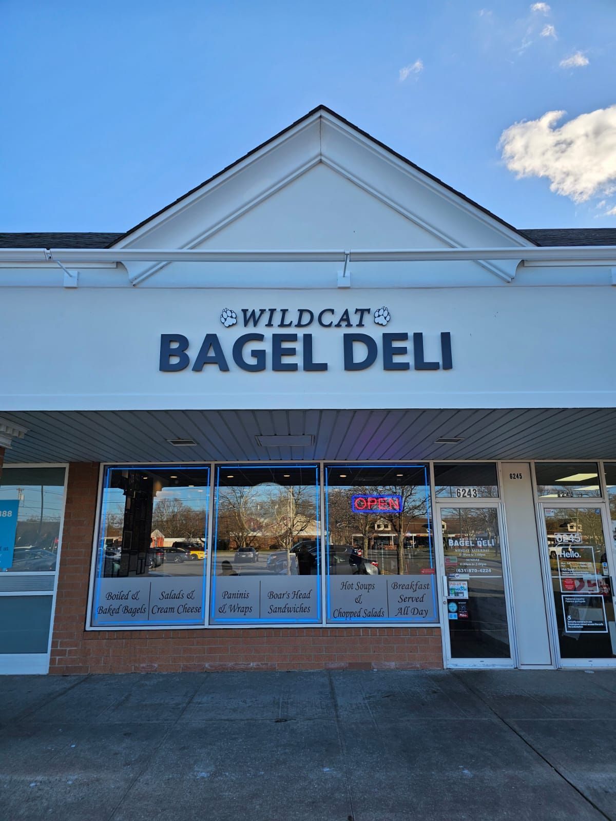 The front of a wildcats bagel deli store