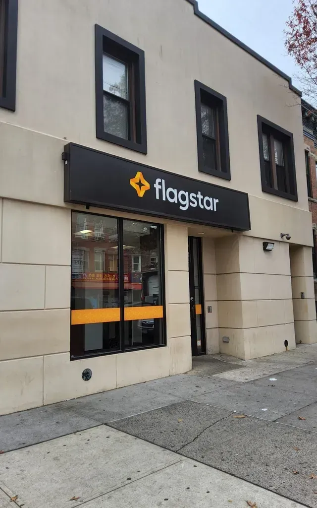 A Flagstar store is located on the side of a building.
