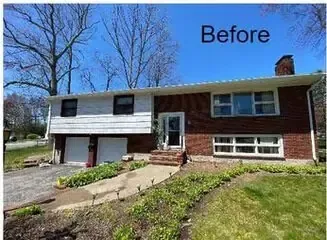 Before photo of a split-level house with white and red brick exterior and a front yard walkway