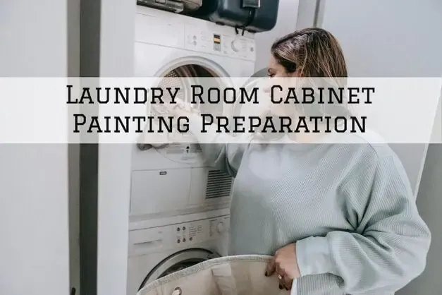 Laundry room cabinet painting prep with a person standing beside a washer and dryer.