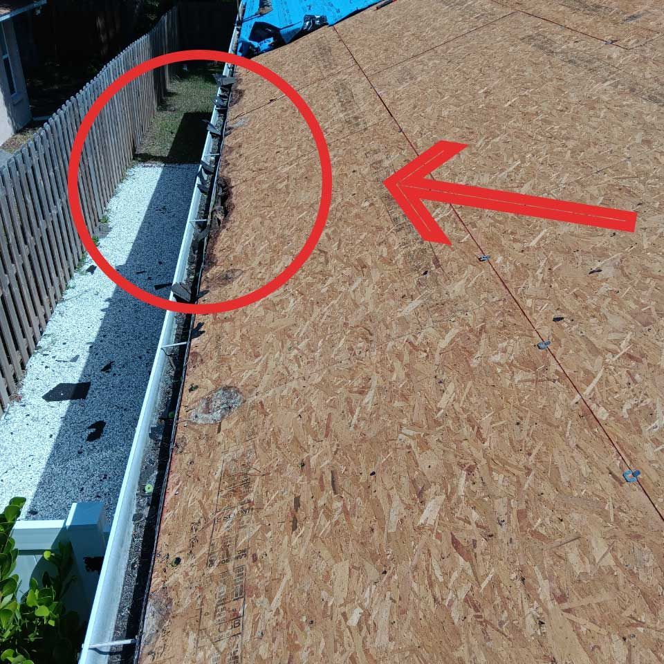 A roof with a red arrow pointing to it