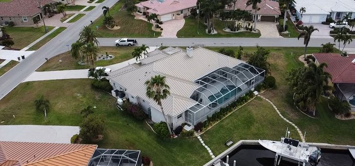 An aerial view of a house in a residential area