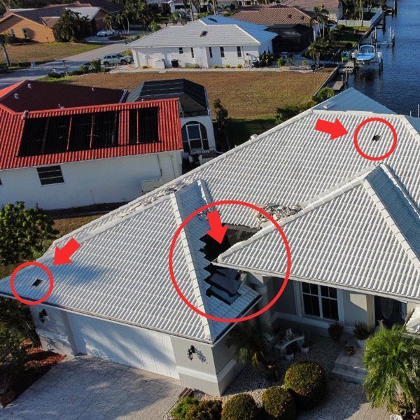 An aerial view of a house with a hole in the roof