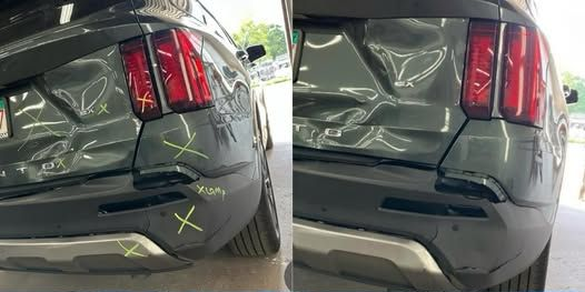 Red car with front-end damage, including a dented fender and broken headlight.