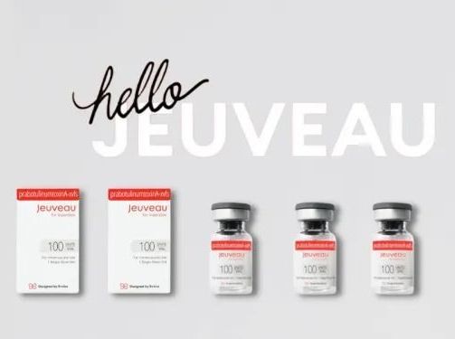 A group of bottles are sitting next to each other on a table.