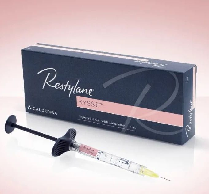 A group of bottles are sitting next to each other on a table.