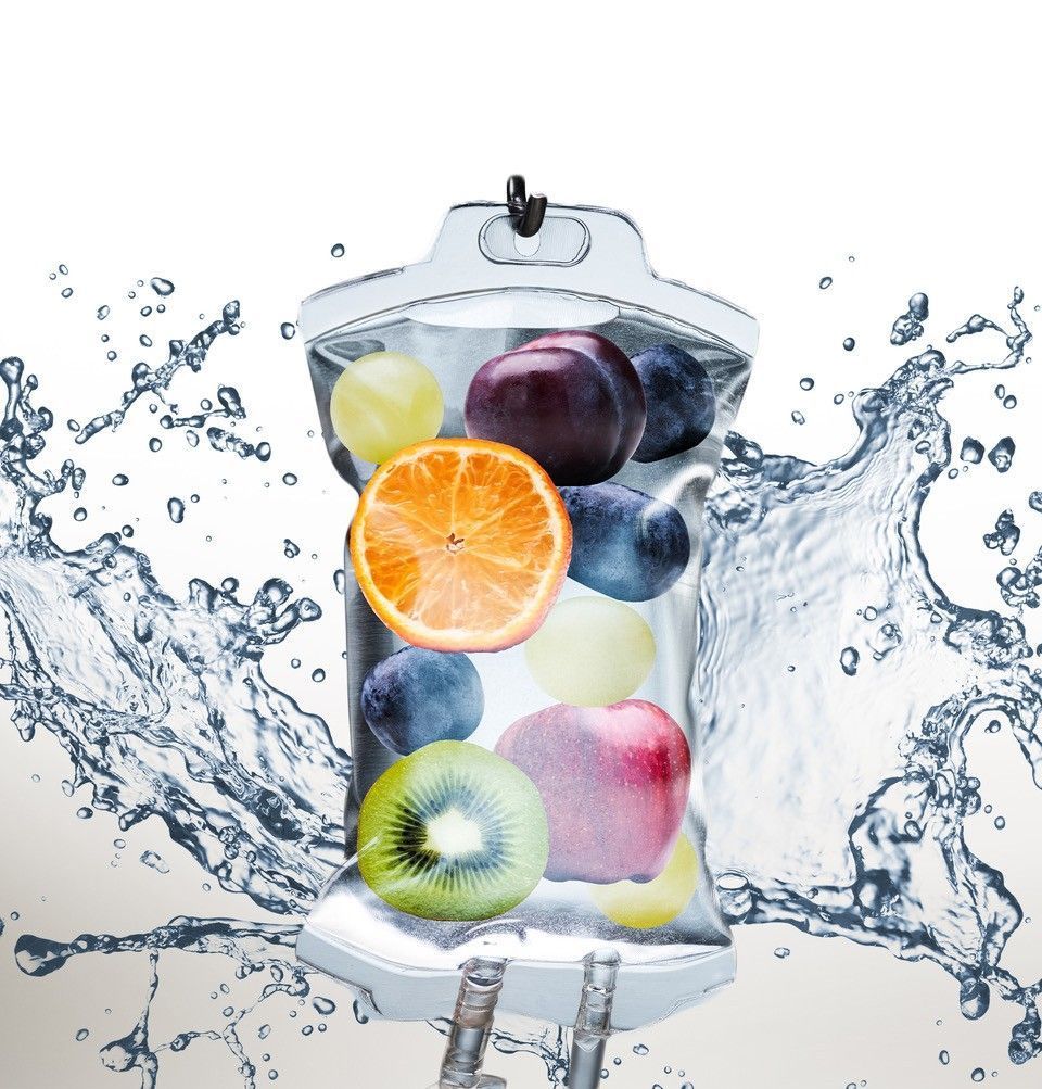 A bag filled with fruit is being splashed with water.
