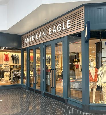 An american eagle store with mannequins in front of it