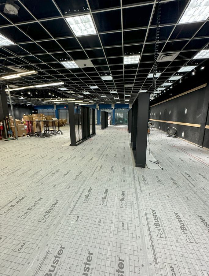 A large room with a ceiling that has a lot of lights on it.