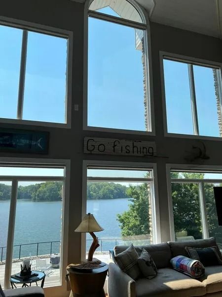 Large windows overlooking a lake, a 