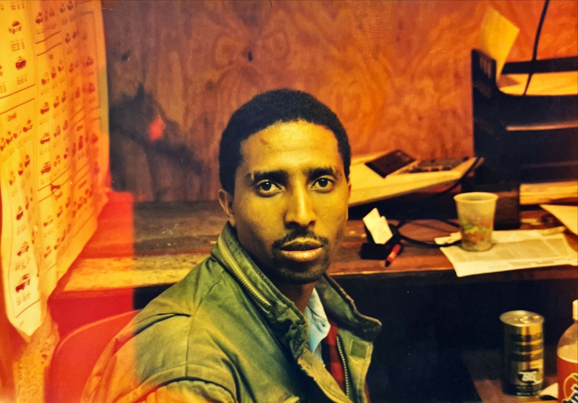 Silhouette of a person from the shoulders up, against a gray background.