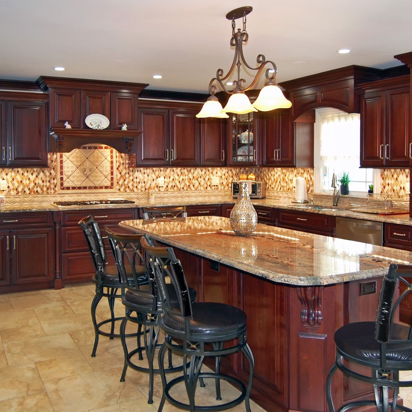 Kitchen with dark wood cabinets, granite countertops, and a central island with bar stools.