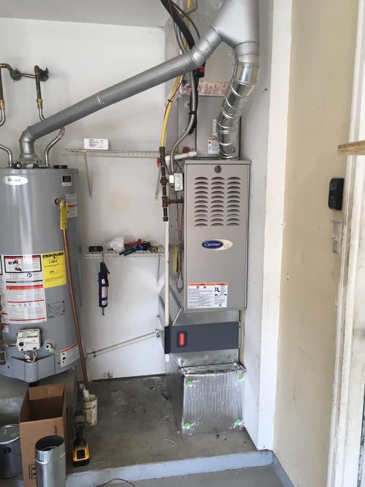 There is a water heater and an air conditioner in the room.