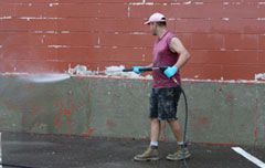 Guy cleaning a wall