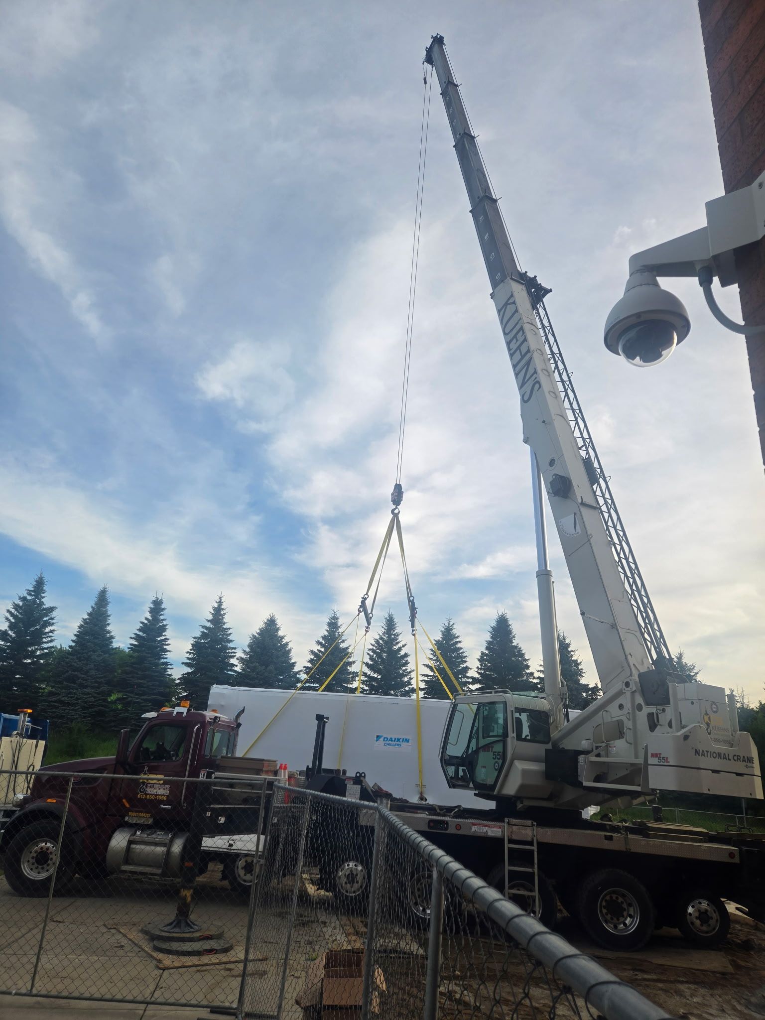 A large crane is being used to lift a large object