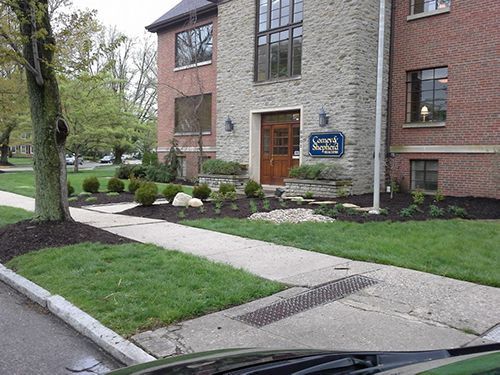 A brick building with a sign that says summit square