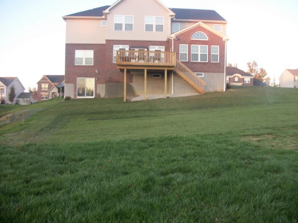 The back of a house with a deck and stairs