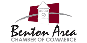 Logo of the Benton Area Chamber of Commerce. Features a tower over red and a gray arc, with text below.