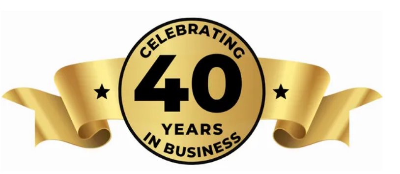 Gold emblem celebrating 40 years in business, with a gold ribbon and two black stars.