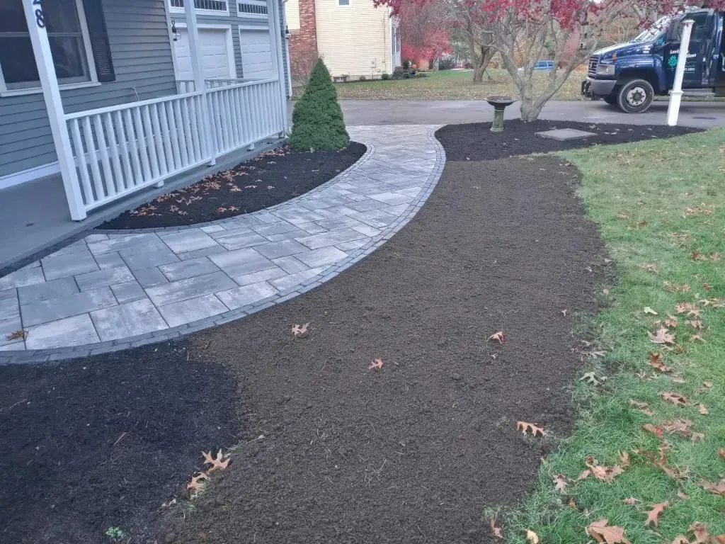 A walkway is being built in front of a house.