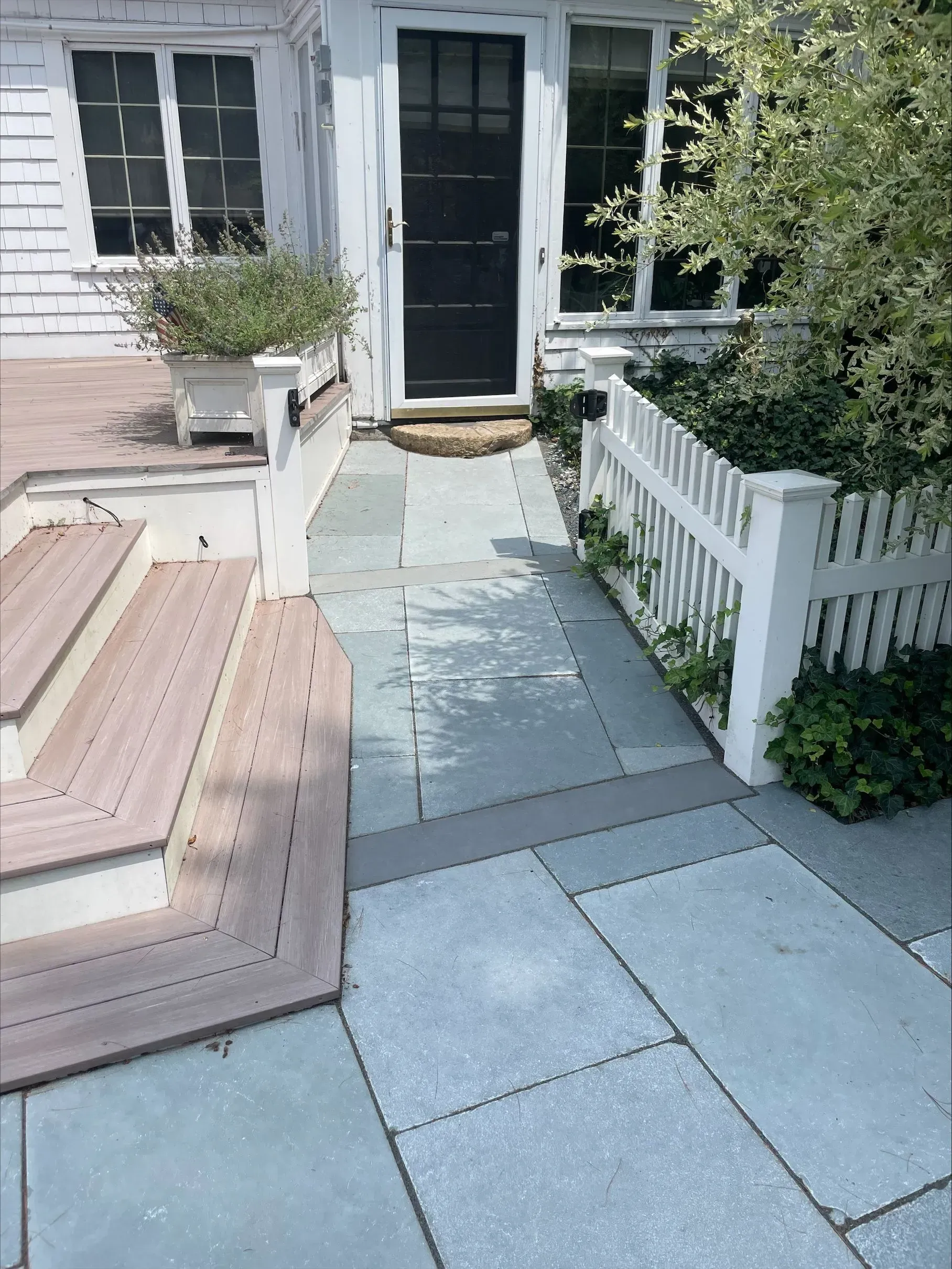 A walkway leading to the front door of a house