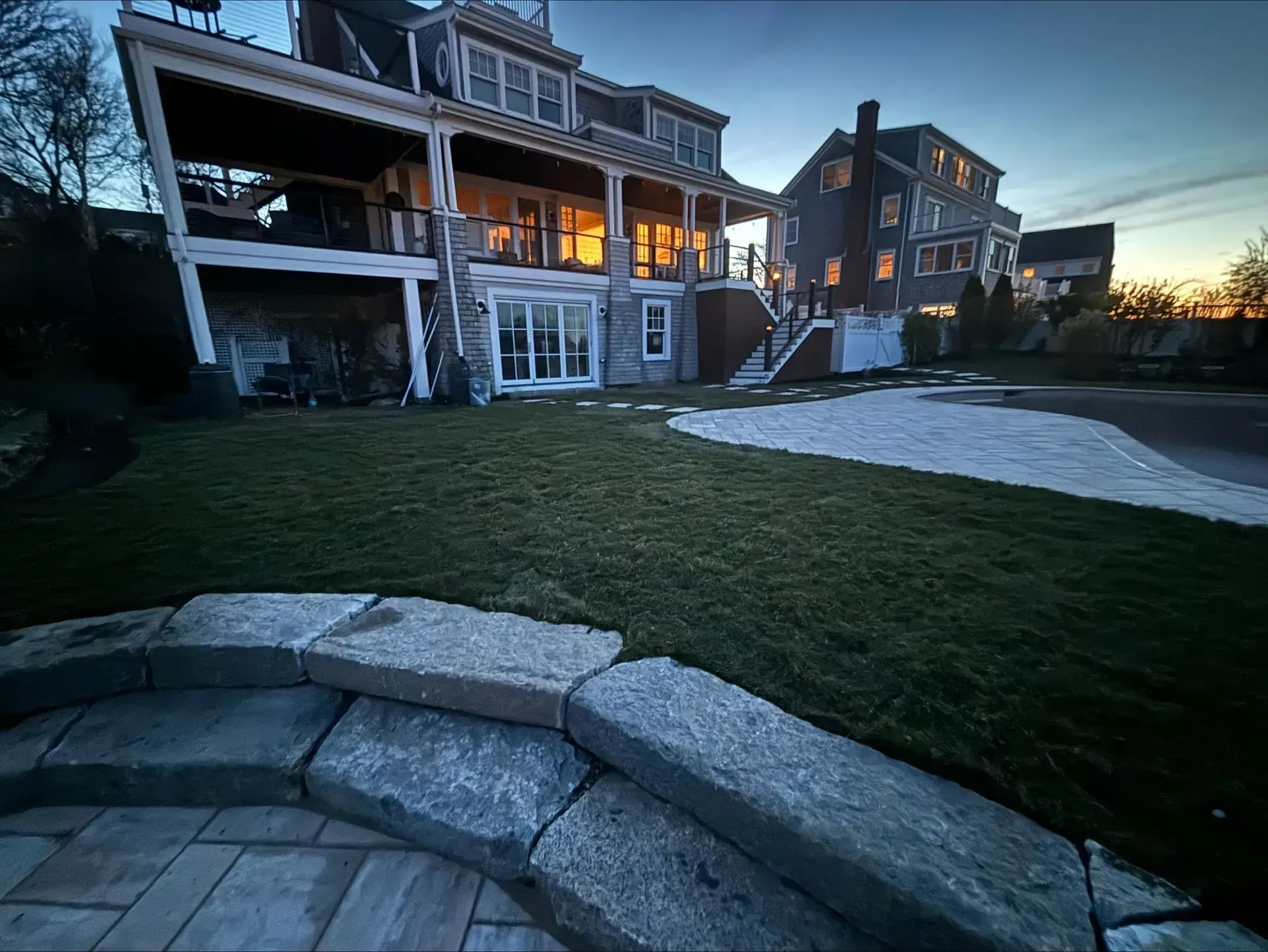 A large house with a large lawn in front of it