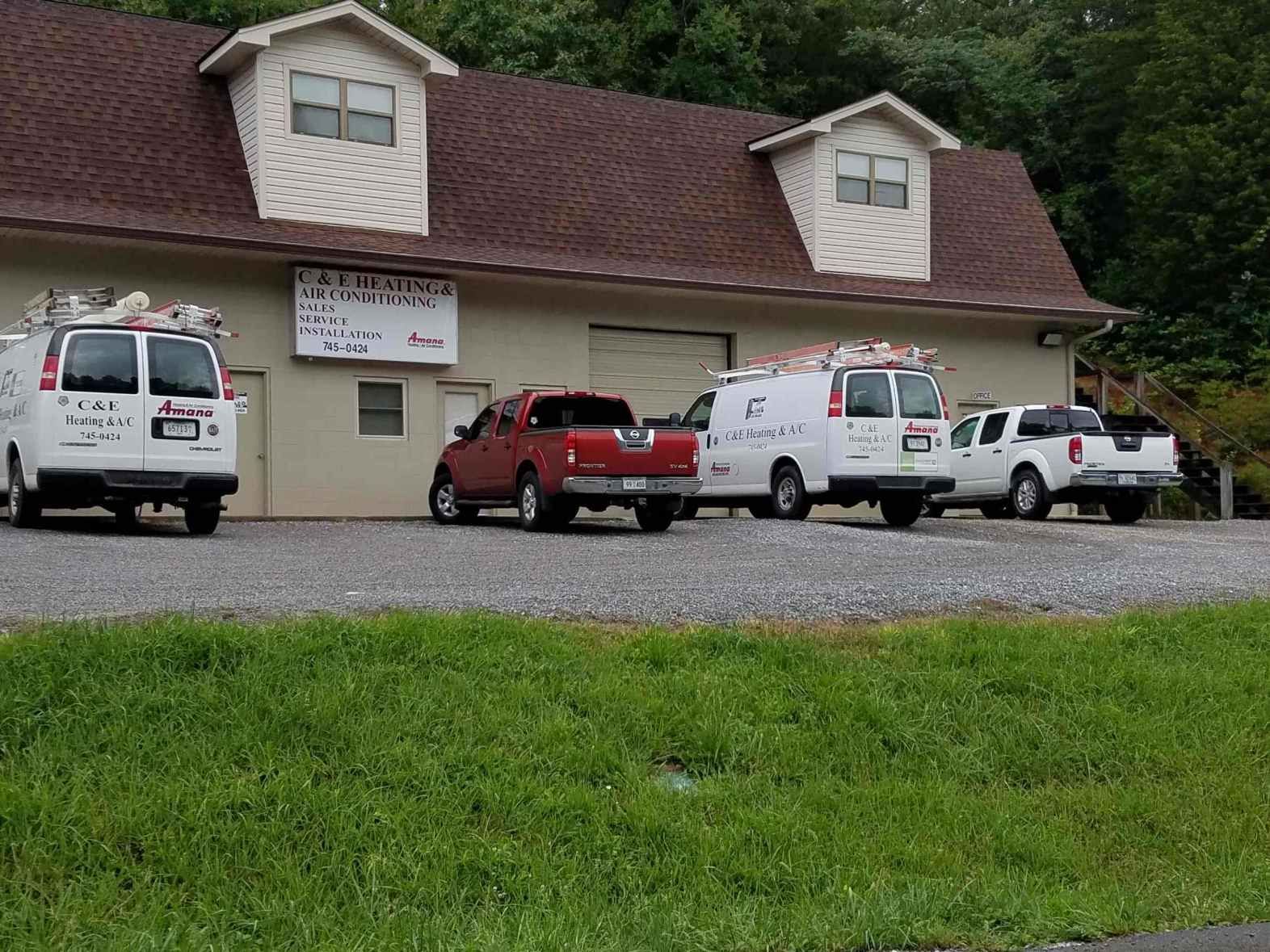 A row of vans parked in front of a building