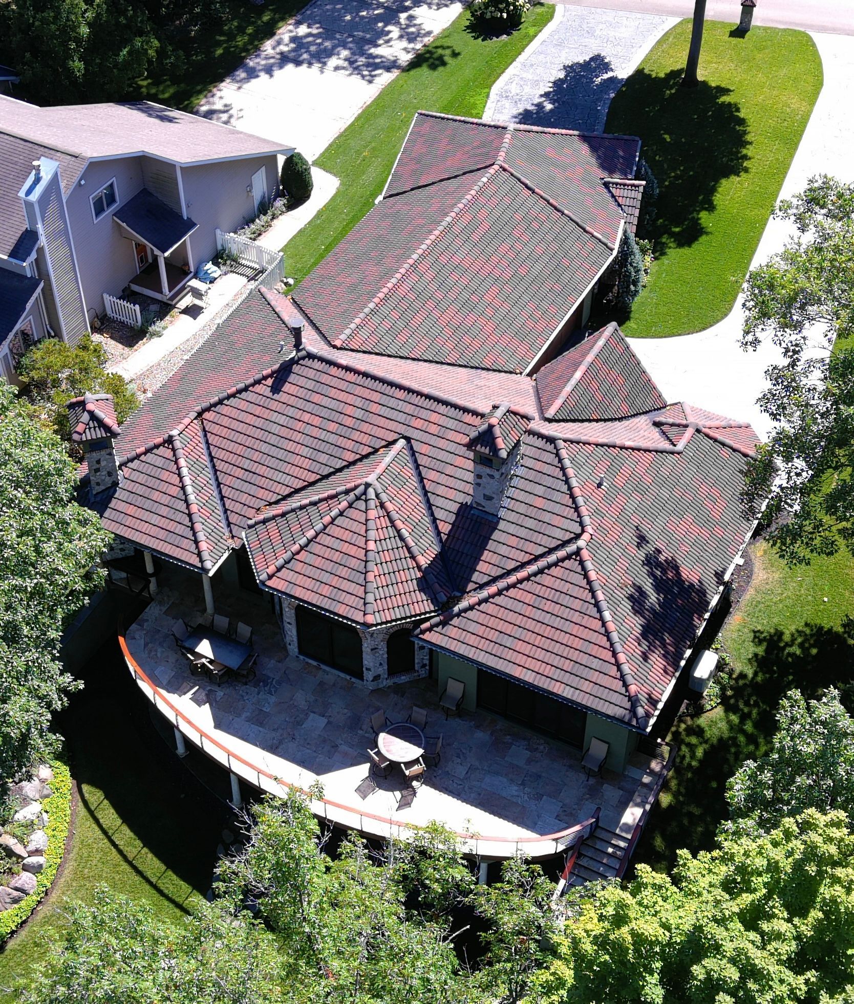 An aerial view of a house with a curved roof