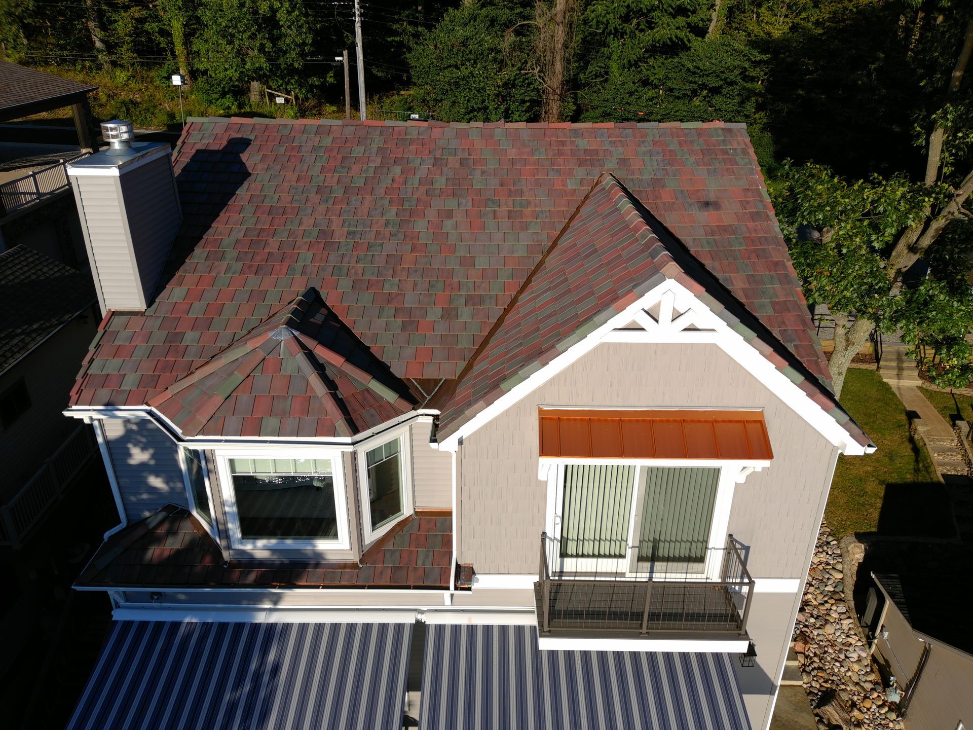 An aerial view of a house with a red roof.