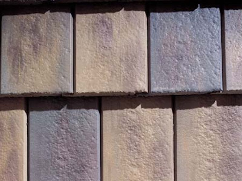 Steel Tan - Cotswold Stone style sprayed dark brown #2. Laid in a random pattern.