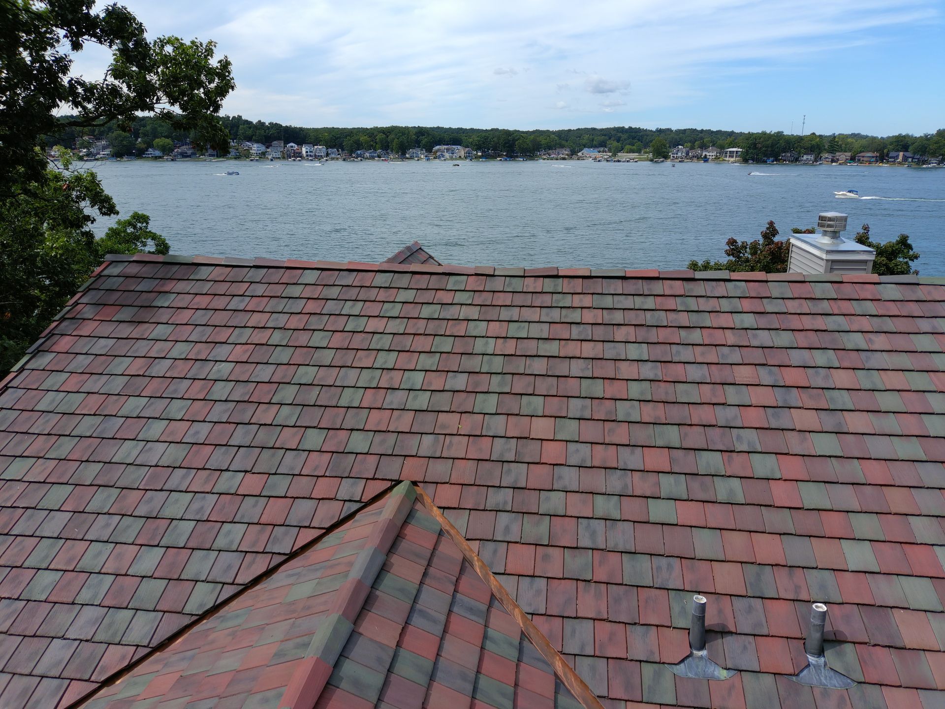A roof with a view of a body of water