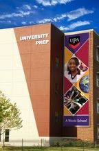 University Prep school building with colorful UPA mural and blue sky
