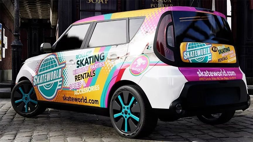 A colorful branded skating rental van is parked on a cobblestone street, with teal rims and pink-white graphics.