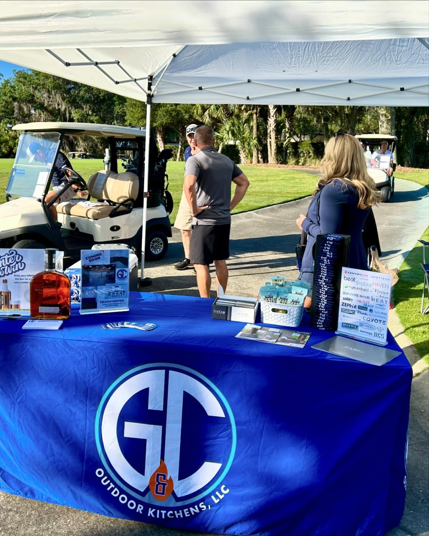 A booth with a blue table cover promoting 