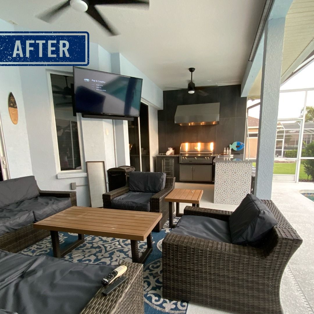 Outdoor patio with seating, grill, TV, and fireplace. Blue, gray, and brown tones.