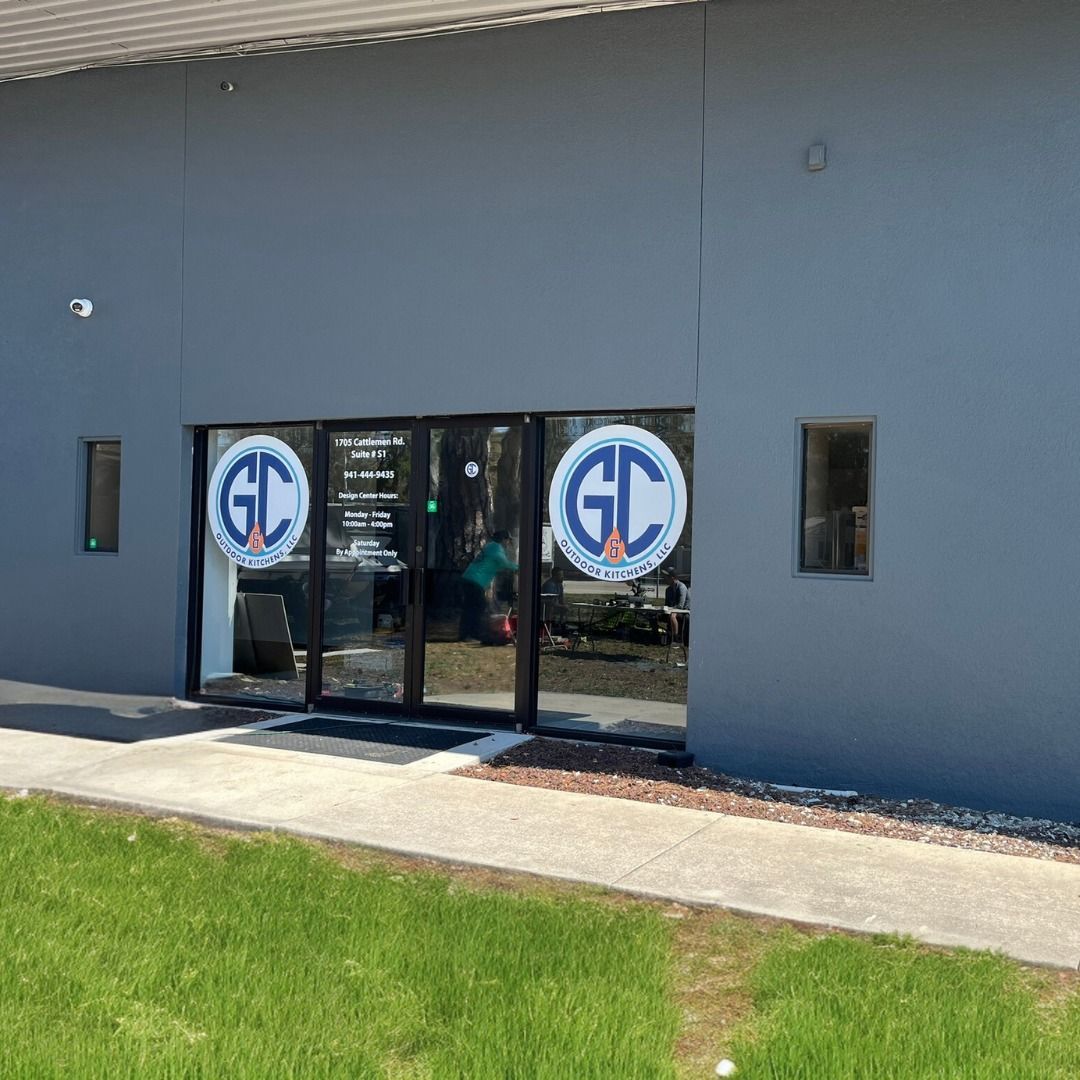 Gray building with glass doors displaying 