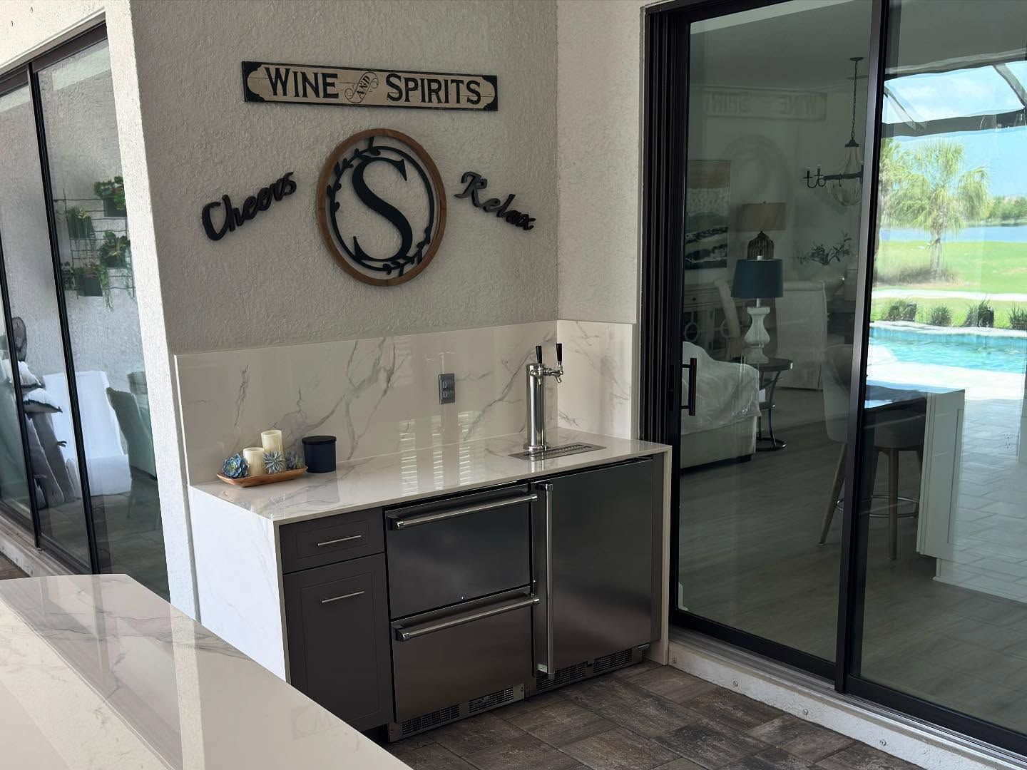 Outdoor bar with tap, stainless steel appliances, and 