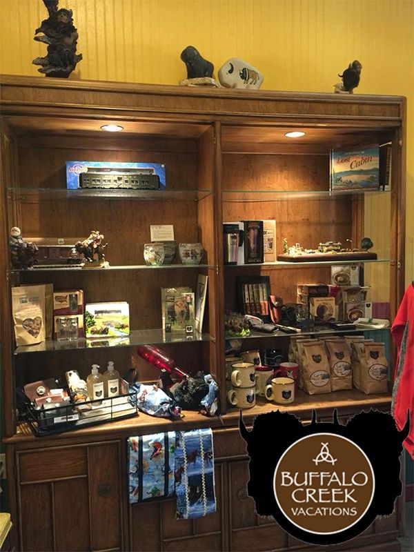 A display case with a sign that says buffalo creek vacations