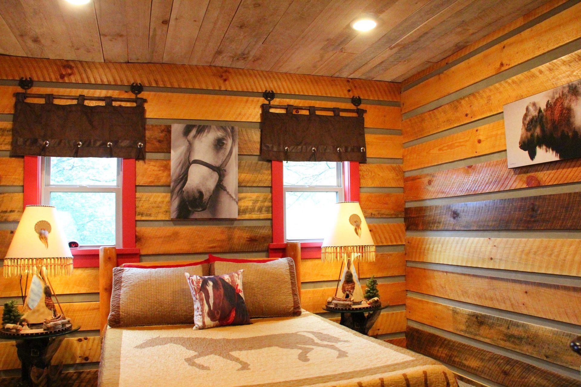 A bedroom with a bed a television and a sign that says the rock room