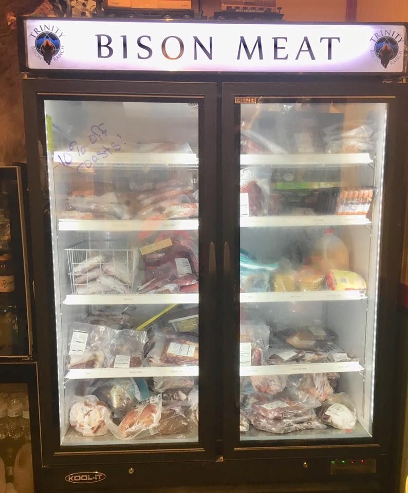 A refrigerator filled with lots of meat and vegetables.