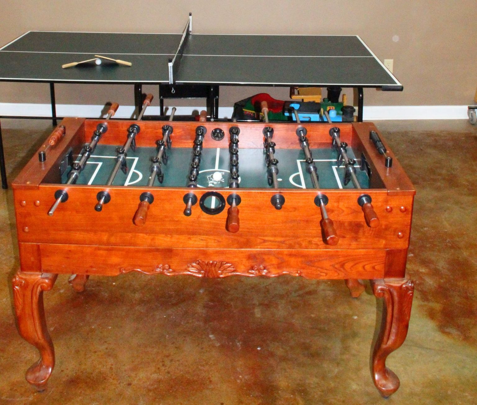 A foosball table with the letter p on it