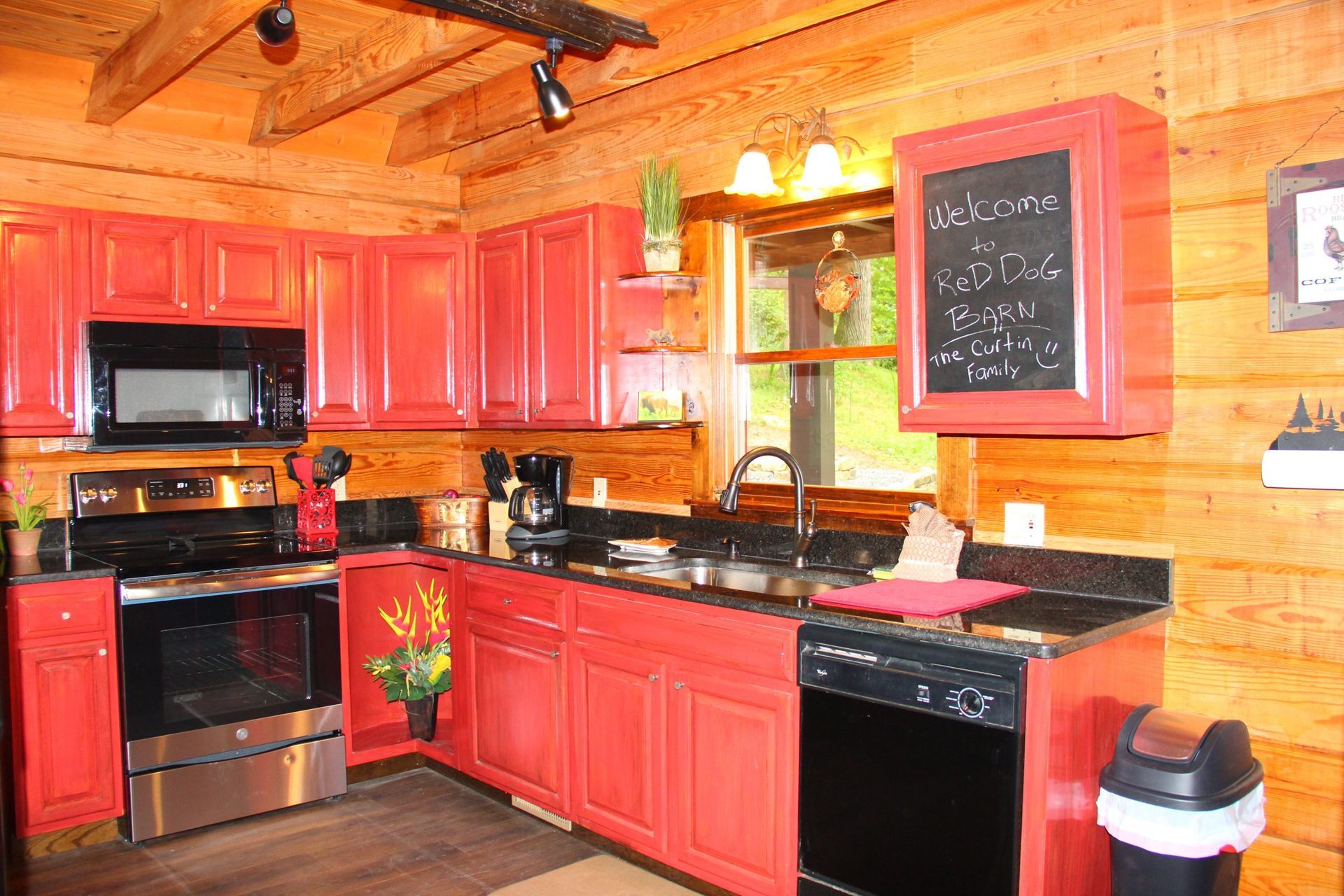 A shower with two shower heads and a stone floor.