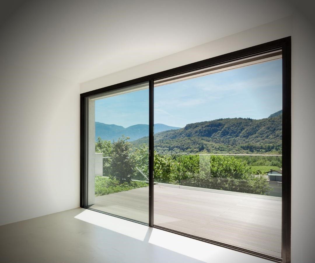 There is a large window with a view of the mountains.